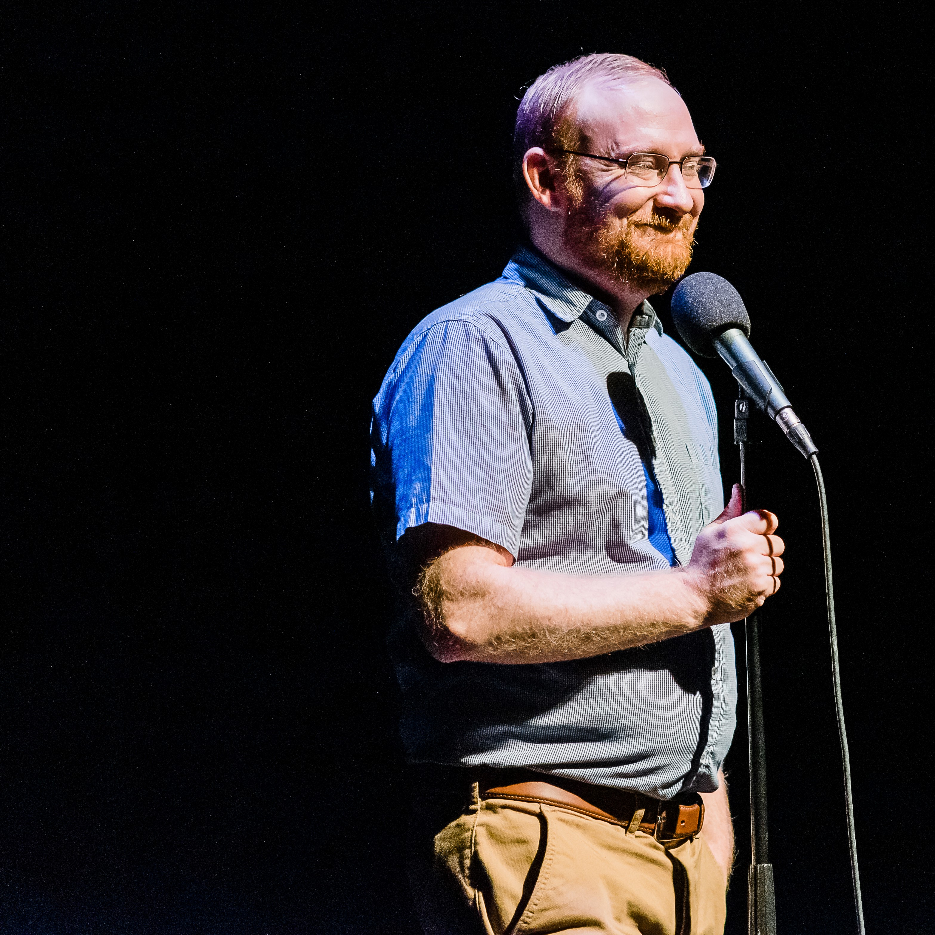 Corey Rhoads telling a story for The Narrators at Buntport Theater, August 2019