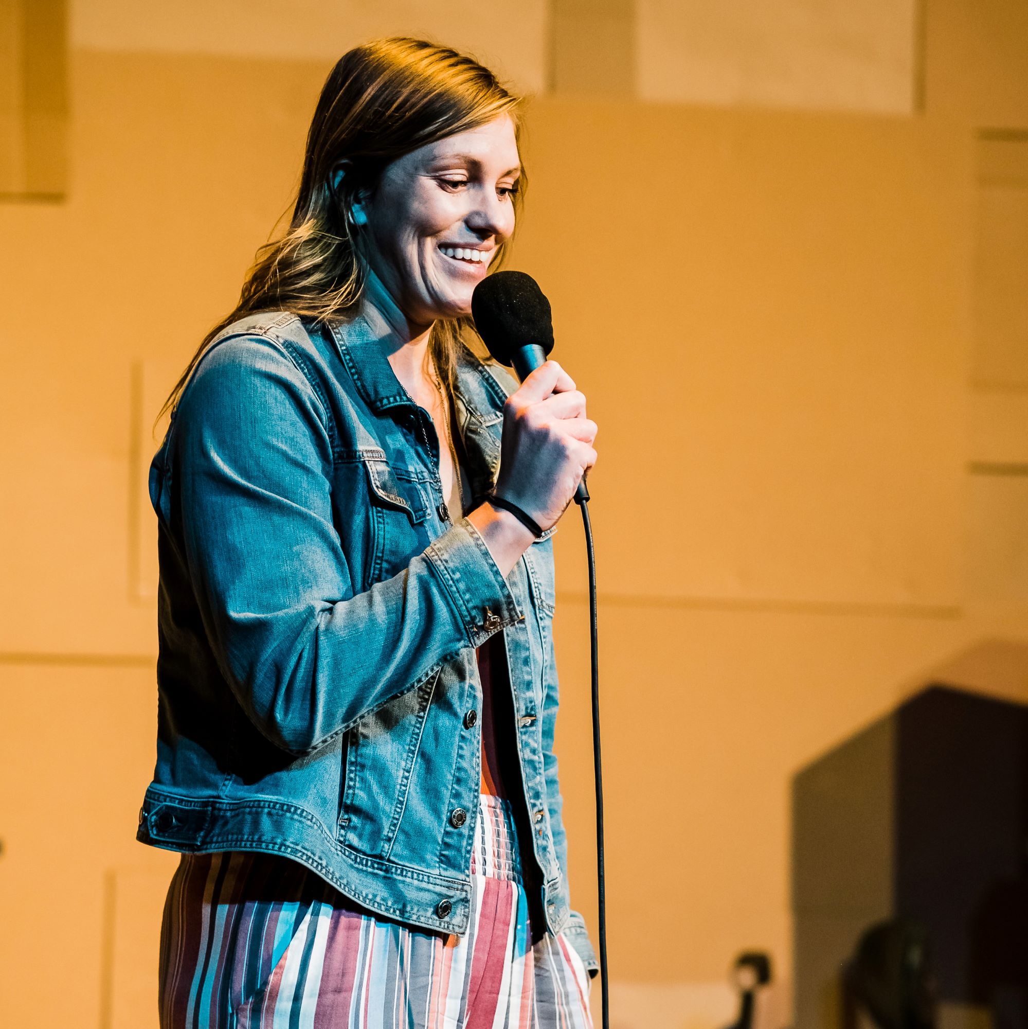 Kate Strobel telling a story at The Narrators, October 2019